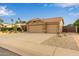 Charming single-story home showcasing a desert landscaped front yard and a spacious two-car garage at 1453 E Butler Cir, Chandler, AZ 85225