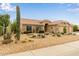 Charming single-story home with desert landscaping, stone accents, and a tile roof at 1453 E Butler Cir, Chandler, AZ 85225