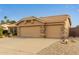 Spacious two-car garage with stone accents and a well-maintained driveway, providing ample parking space at 1453 E Butler Cir, Chandler, AZ 85225