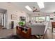 Bright living room with skylights, ceiling fan, gray sofa, and stylish decor at 1453 E Butler Cir, Chandler, AZ 85225