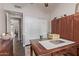 Home office featuring a writing desk, cabinets, and large closet for a functional workspace at 1453 E Butler Cir, Chandler, AZ 85225