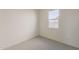 Bright bedroom featuring neutral walls, carpet flooring, and a window at 15580 S 181St Ln, Goodyear, AZ 85338