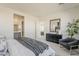 Bright main bedroom featuring a stylish sitting area, ensuite, and neutral tones at 15580 S 181St Ln, Goodyear, AZ 85338