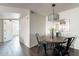 Cozy dining area with stylish black chairs and modern chandelier at 16402 N 31St St # 115, Phoenix, AZ 85032