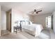 Spacious main bedroom featuring a ceiling fan and carpeted floors at 16402 N 31St St # 115, Phoenix, AZ 85032