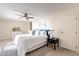 Bright main bedroom with a ceiling fan and a king size bed at 16402 N 31St St # 115, Phoenix, AZ 85032