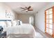 Large main bedroom with ceiling fan and access to the patio at 16402 N 31St St # 115, Phoenix, AZ 85032