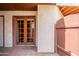 Enclosed patio with double doors to the home's interior, and a low privacy fence at 16402 N 31St St # 115, Phoenix, AZ 85032