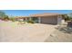 Home exterior displaying desert landscaping, an extended driveway, and attached two-car garage at 16413 N Orchard Hills Dr, Sun City, AZ 85351