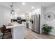 Bright kitchen featuring white cabinets, stainless steel appliances, and modern finishes at 16413 N Orchard Hills Dr, Sun City, AZ 85351