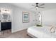 A soothing bedroom showcases a ceiling fan and doorway to a modern bathroom at 16413 N Orchard Hills Dr, Sun City, AZ 85351