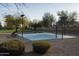 Community basketball court, benches, and trees for shading on a sunny day at 16634 N 33Rd Way, Phoenix, AZ 85032