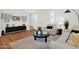 Cozy living room features modern decor, a stylish rug, and ample natural light at 16875 N 12Th St # 24, Phoenix, AZ 85022