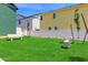 Backyard common area featuring a grassy lawn, concrete benches, privacy fence and young shade trees at 16875 N 12Th St # 3, Phoenix, AZ 85022