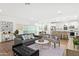 Bright living room with modern decor, stylish furniture, and a view into the kitchen at 16875 N 12Th St # 3, Phoenix, AZ 85022