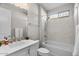 Bathroom featuring a soaking tub, white vanity, and sleek fixtures at 16945 W Vernon Ave, Goodyear, AZ 85395