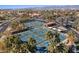 An aerial view showcases multiple pickleball courts lined with palm trees, providing a vibrant community atmosphere at 16945 W Vernon Ave, Goodyear, AZ 85395