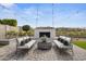 Relaxing backyard with outdoor seating, a fireplace, and inviting ambiance for entertaining at 18007 N 66Th Way, Phoenix, AZ 85054