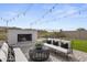 Serene outdoor space with a cozy fireplace and comfortable seating offering a perfect spot for relaxation at 18007 N 66Th Way, Phoenix, AZ 85054