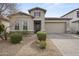 Charming home featuring a well-maintained front yard with low maintenance desert landscaping at 18007 N 66Th Way, Phoenix, AZ 85054