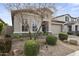 Beautiful home featuring manicured landscaping, gravel, and mature trees at 18007 N 66Th Way, Phoenix, AZ 85054