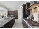 Modern kitchen with stainless steel appliances, tiled backsplash, and a gas cooktop at 18007 N 66Th Way, Phoenix, AZ 85054