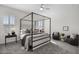 Serene main bedroom features a canopy bed, soft carpeting, and bright, natural light at 18007 N 66Th Way, Phoenix, AZ 85054