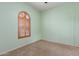 Cozy bedroom with carpet flooring and a window with shutters for a warm touch at 18178 W Desert View Ln, Goodyear, AZ 85338