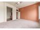 Spacious bedroom with neutral carpet and accent wall at 18178 W Desert View Ln, Goodyear, AZ 85338