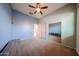 Bedroom featuring neutral carpet, fresh paint, and double door closet at 18178 W Desert View Ln, Goodyear, AZ 85338