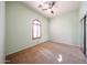 Bedroom featuring a ceiling fan, natural lighting, and a sliding door closet at 18178 W Desert View Ln, Goodyear, AZ 85338