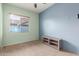 Bedroom with a light color scheme, carpet flooring, and a window for natural light at 18178 W Desert View Ln, Goodyear, AZ 85338