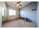 Bedroom featuring carpet flooring, natural light, and a ceiling fan at 18178 W Desert View Ln, Goodyear, AZ 85338