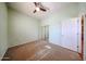 Bright bedroom with a ceiling fan, carpet flooring and natural light at 18178 W Desert View Ln, Goodyear, AZ 85338