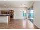 Bright dining area with hardwood floors and glass slider to patio at 18178 W Desert View Ln, Goodyear, AZ 85338