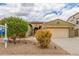 Charming single-story home with a two-car garage, desert landscaping, and mature trees in a desirable neighborhood at 18178 W Desert View Ln, Goodyear, AZ 85338