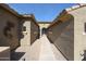 Inviting front entrance showcasing a desert-style walkway leading to the front door at 18178 W Desert View Ln, Goodyear, AZ 85338