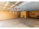 Spacious garage featuring built-in cabinets and ample storage and work space at 18178 W Desert View Ln, Goodyear, AZ 85338