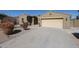 Charming home featuring a spacious two-car garage and well-maintained desert landscaping at 18178 W Desert View Ln, Goodyear, AZ 85338