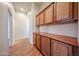 Hallway with built-in cabinets and drawers providing ample storage space at 18178 W Desert View Ln, Goodyear, AZ 85338