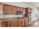 Kitchen features wood cabinets and stainless steel double ovens at 18178 W Desert View Ln, Goodyear, AZ 85338