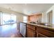 Large kitchen island provides bar seating, ample counter space and a stainless steel dishwasher at 18178 W Desert View Ln, Goodyear, AZ 85338