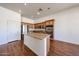 Stylish kitchen featuring stainless steel appliances, granite counters, and ample cabinet space at 18178 W Desert View Ln, Goodyear, AZ 85338