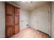 The laundry room features wood cabinets, wood floor, and a door to the outside at 18178 W Desert View Ln, Goodyear, AZ 85338