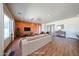 Open-concept living area with a cozy sofa, modern lighting, and seamless flow to other spaces at 18178 W Desert View Ln, Goodyear, AZ 85338