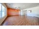 Light-filled living room featuring wood floors and neutral paint, ready for personalization at 18178 W Desert View Ln, Goodyear, AZ 85338