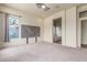 Spacious main bedroom with carpet and a view of the bath at 18178 W Desert View Ln, Goodyear, AZ 85338