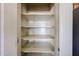 Bright and clean pantry with adjustable shelving provides plenty of storage space at 18178 W Desert View Ln, Goodyear, AZ 85338