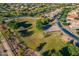 Aerial shot of community park with green space, playground, trees and walking paths at 18436 E Celtic Manor Dr, Queen Creek, AZ 85142