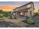 Exterior featuring a covered patio with an outdoor seating area for relaxation at 18436 E Celtic Manor Dr, Queen Creek, AZ 85142